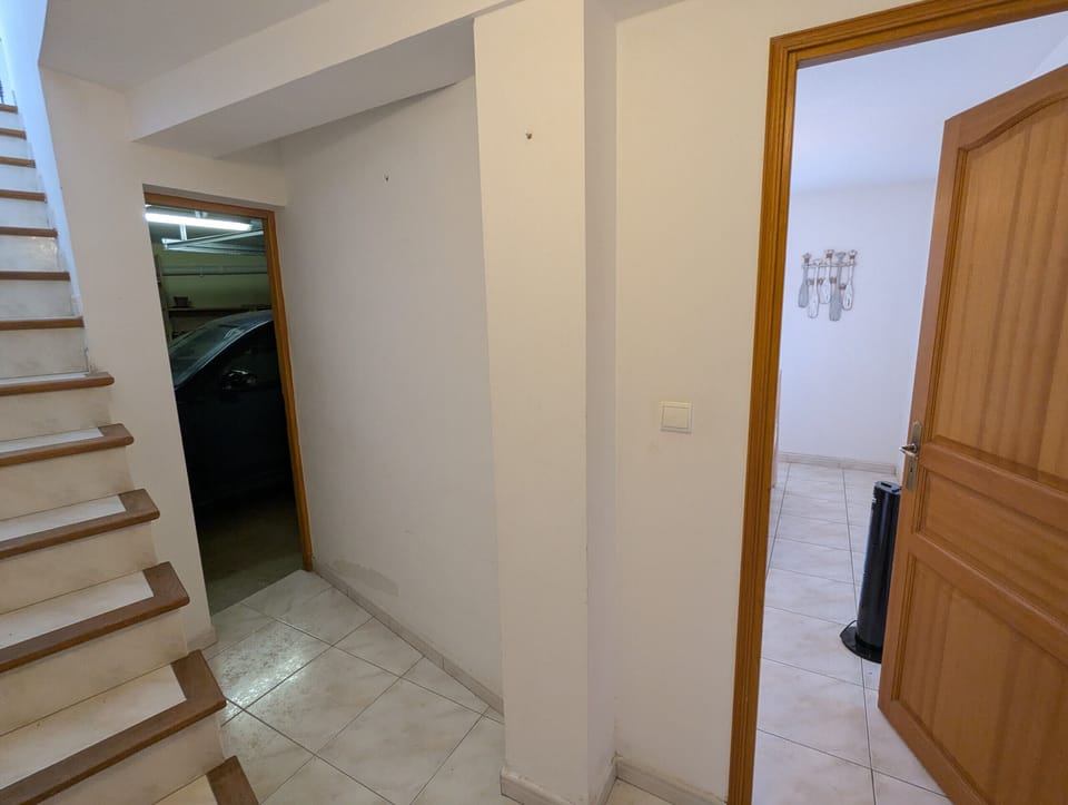 The garage and the 3 bedrooms with access by stairs to the living room.