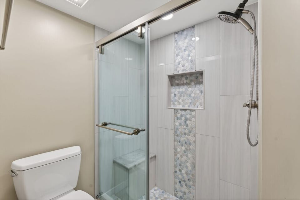 Beautiful tile work and spacious walk-in shower.