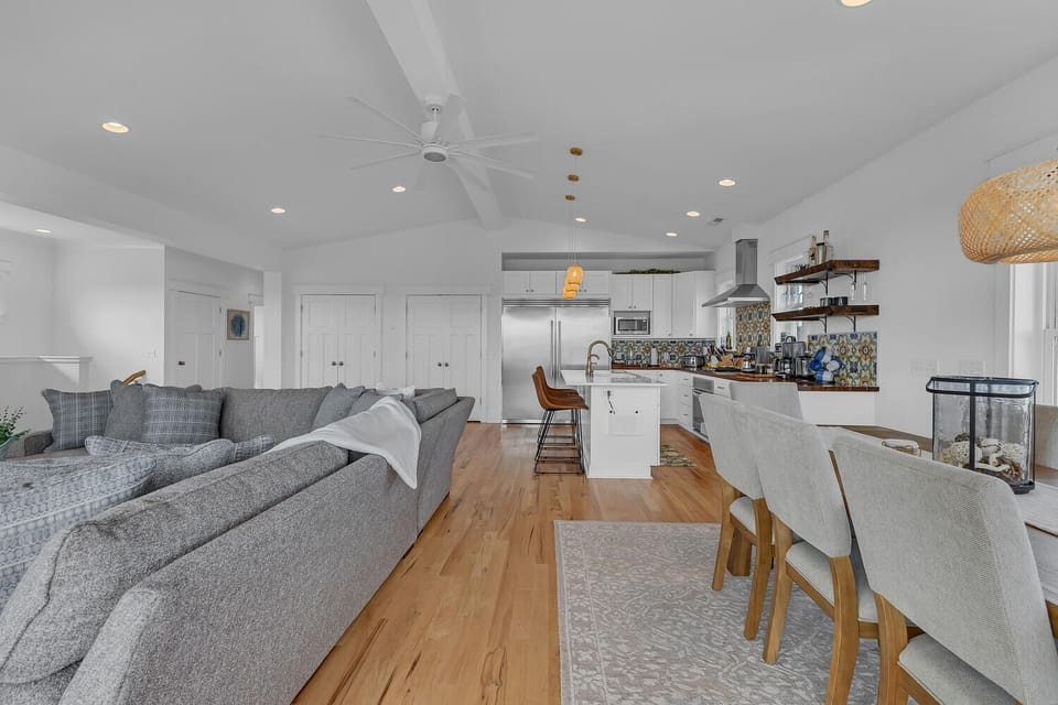 Relax in this stunning open-concept space where coastal chic meets modern comfort—your kitchen, dining, and living areas flow seamlessly together.