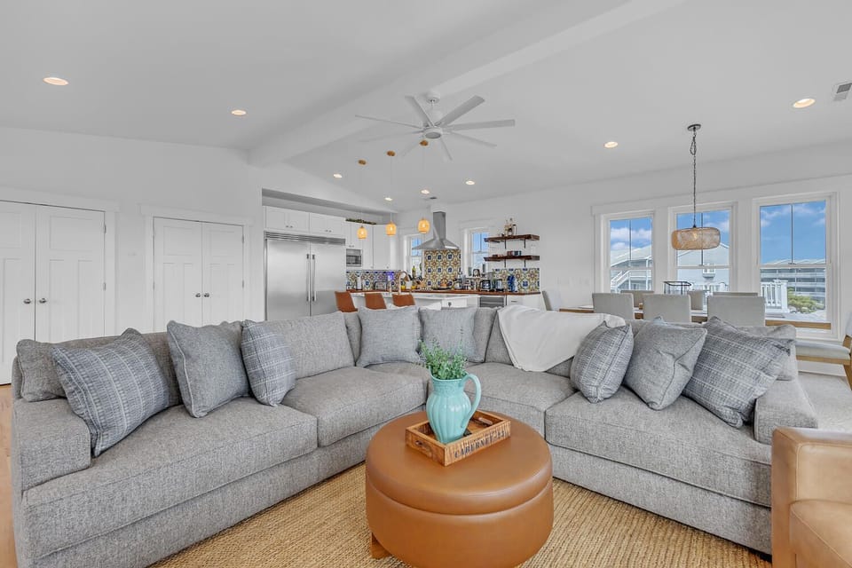 Unwind in your spacious open-plan living area with plush seating and seamless flow to the gourmet kitchen.