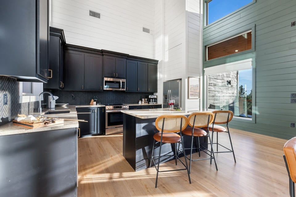 Spacious island with seating in this beautiful, open kitchen