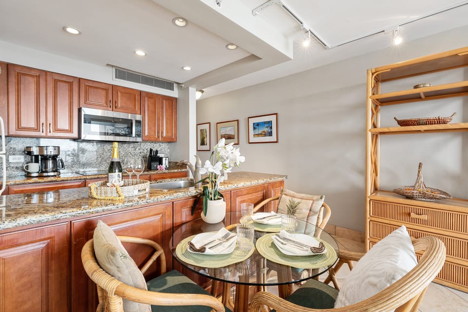 Open-concept living space with dining nook and fully equipped kitchen.