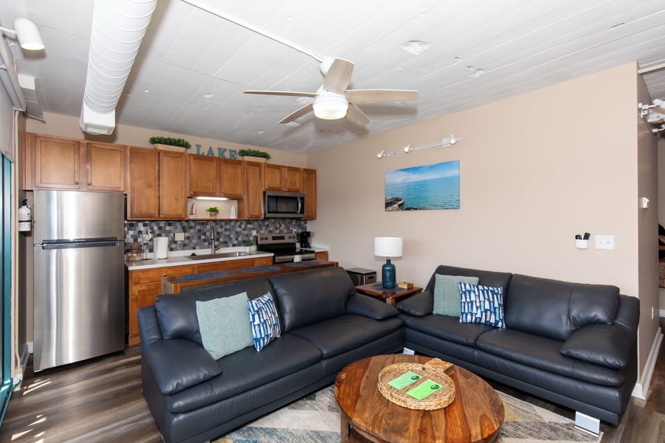 Unwind in your spacious living room with plush leather seating, then whip up meals in your fully equipped kitchen.