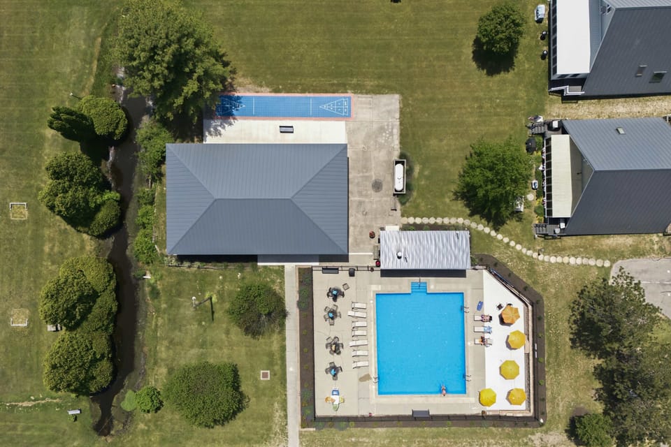 Family friendly amenities include a pool, pavilion, and outdoor games.