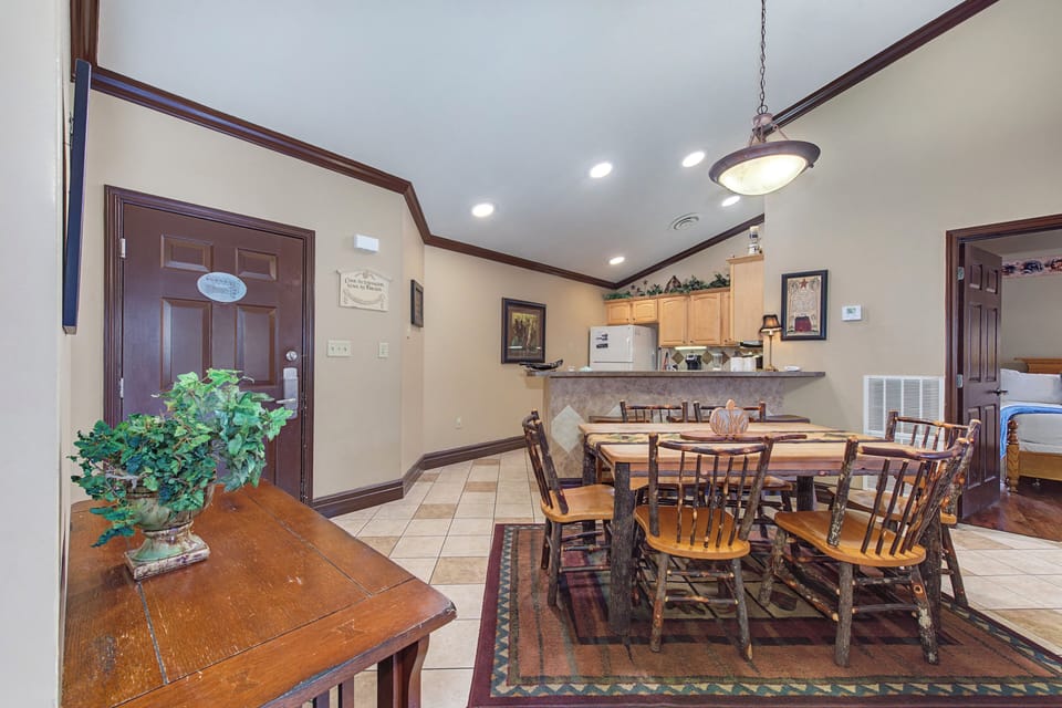 Gather around your spacious dining table for memorable meals, with a fully equipped kitchen just steps away for home-cooked comfort.