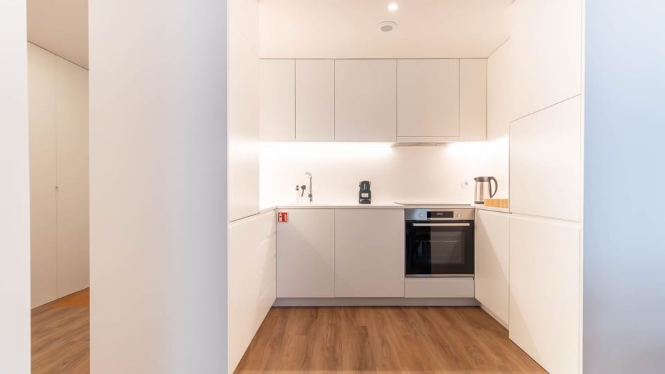 Sleek and modern kitchen with built-in appliances and clean lines. A perfect space to cook and entertain, designed for ultimate functionality. #KitchenGoals #ModernLiving