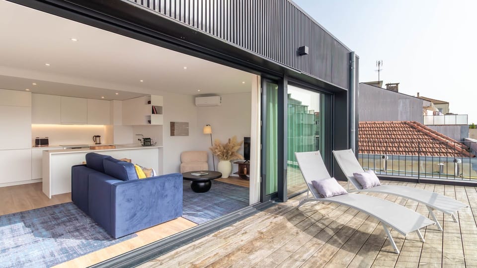 Bright and spacious living area with a seamless transition to the outdoor terrace. Enjoy the view while lounging in comfort. #IndoorOutdoorLiving #ModernDesign