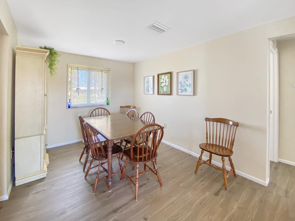 Bright dining area with seating for six, perfect for family meals.