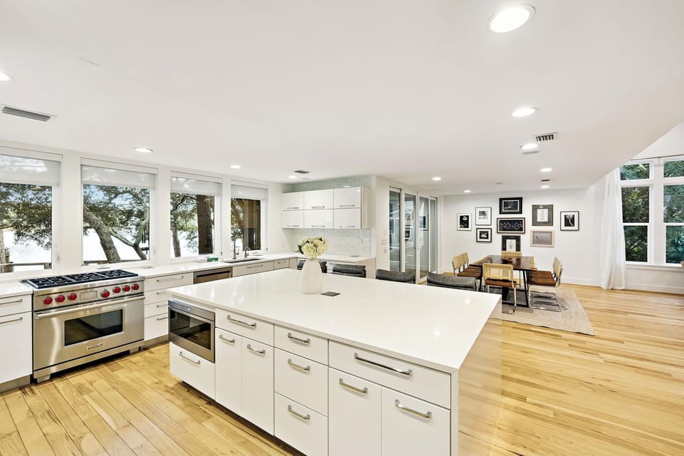 Cook and gather in this stunning open-plan space where your gourmet kitchen flows into comfortable dining with beautiful natural light streaming through floor-to-ceiling windows.