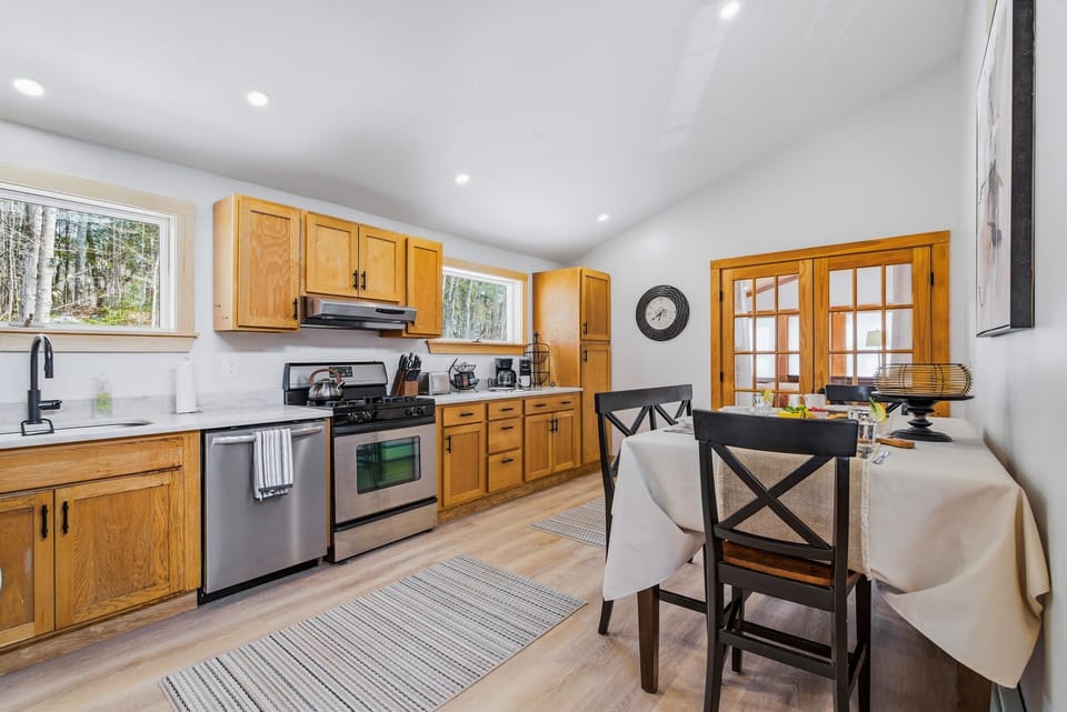 Modern convenience meets rustic warmth: stainless steel appliances and plenty of counter space for family dinners.