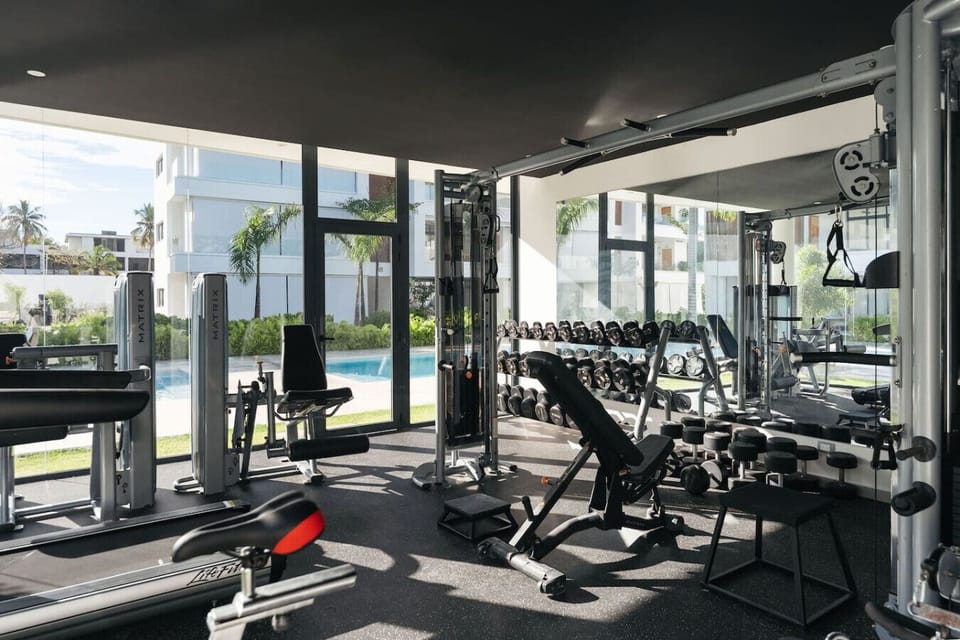 On-site gym with everything you need—free weights, machines, and space for a quick workout, all just a short walk from the unit.