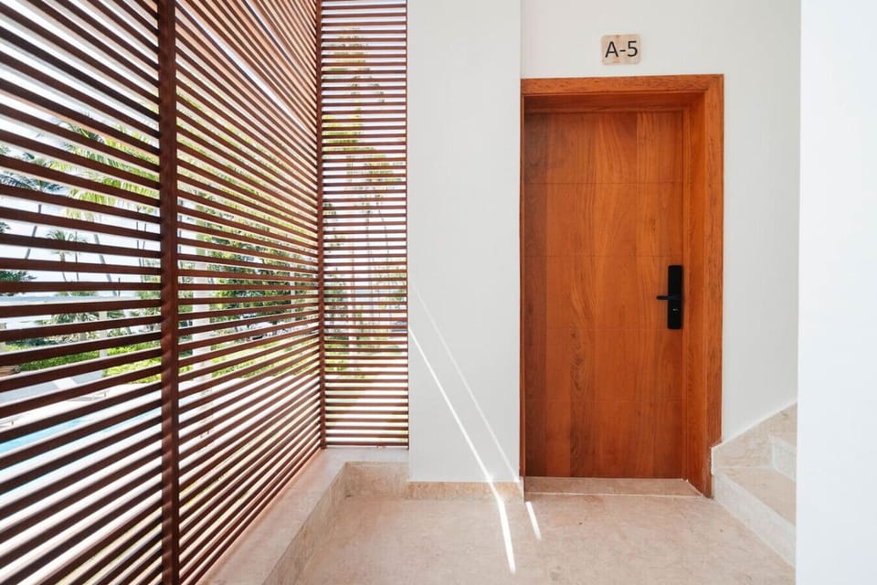 Private entrance with a clean, modern finish. Easy access via keyless entry, tucked along a quiet walkway for a bit of extra privacy.