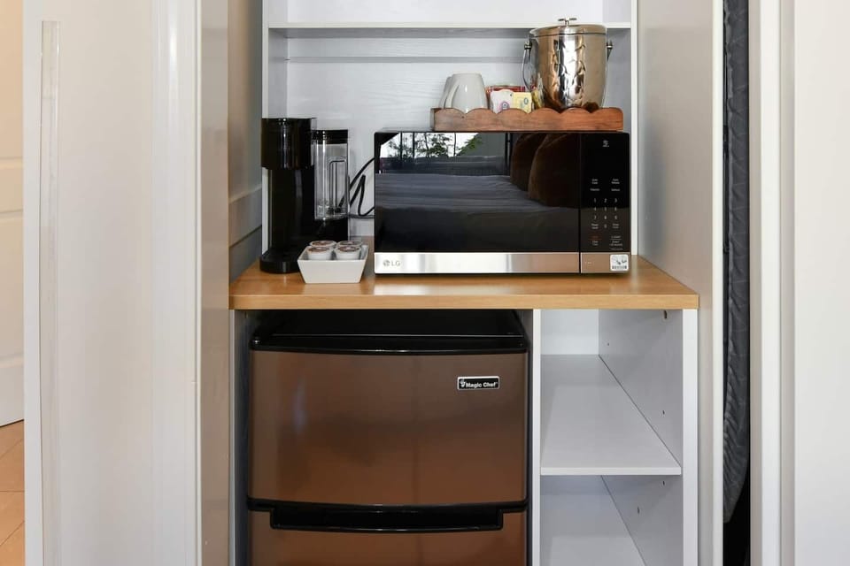 Bedroom 1 has handy coffee station hidden in closet with Keuring K-cup coffee maker, microwave and mini-fridge. 