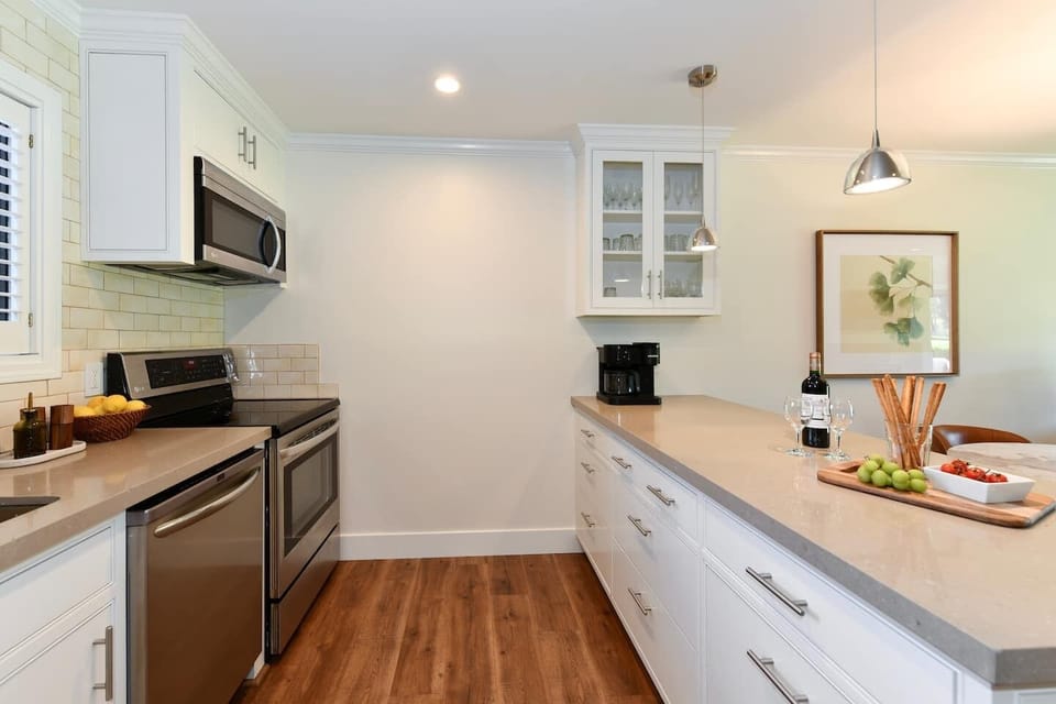 Kitchen is fully furnished with dishes & cookware.