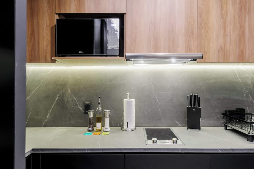 Fully equipped kitchen with modern appliances.