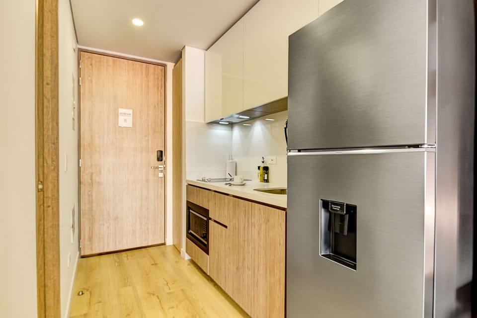 Fully equipped kitchen with modern appliances.