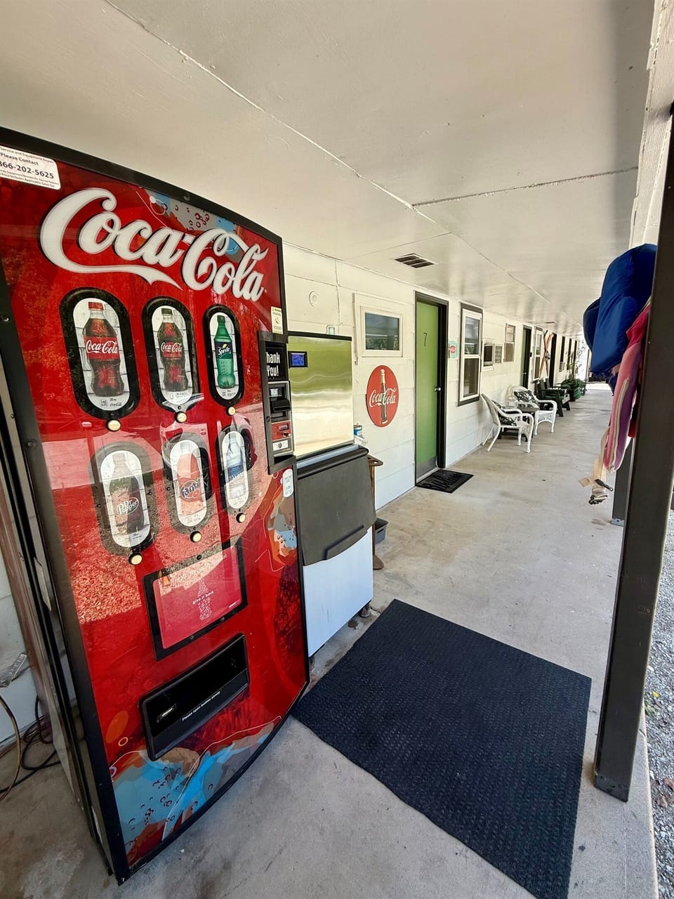 Free ice by the coke machine on the back of the building.