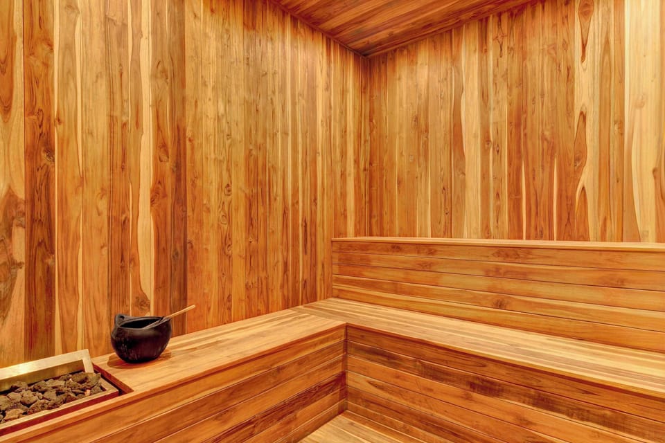 Cozy private sauna finished in warm wood tones, perfect for unwinding and enjoying a relaxing wellness experience after a long day.