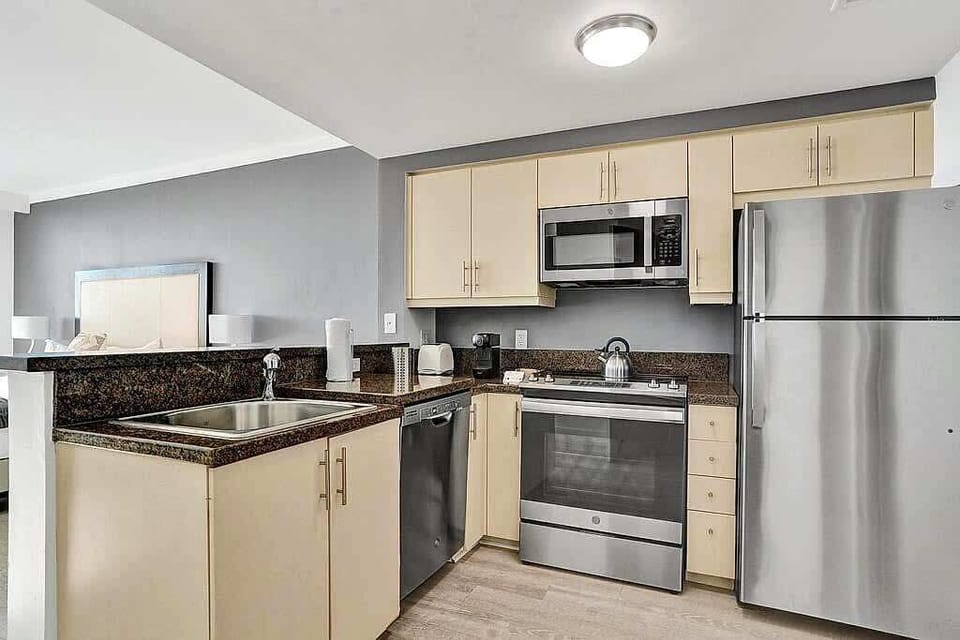 Kitchen with full appliances and granite counters