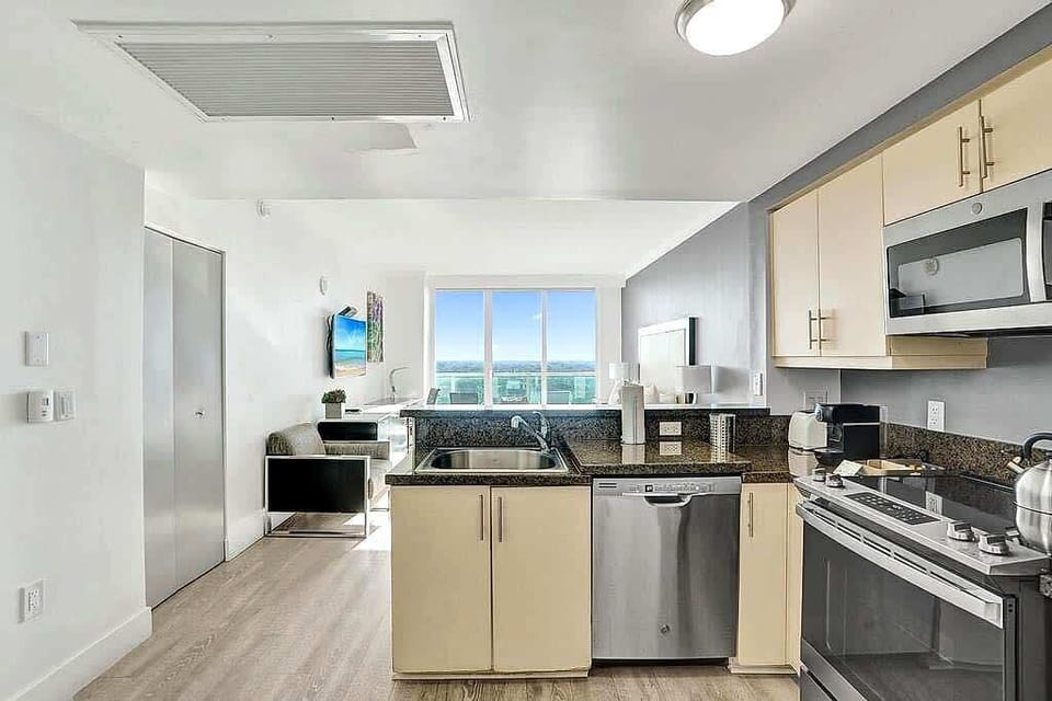 Full kitchen with stainless appliances and ocean views