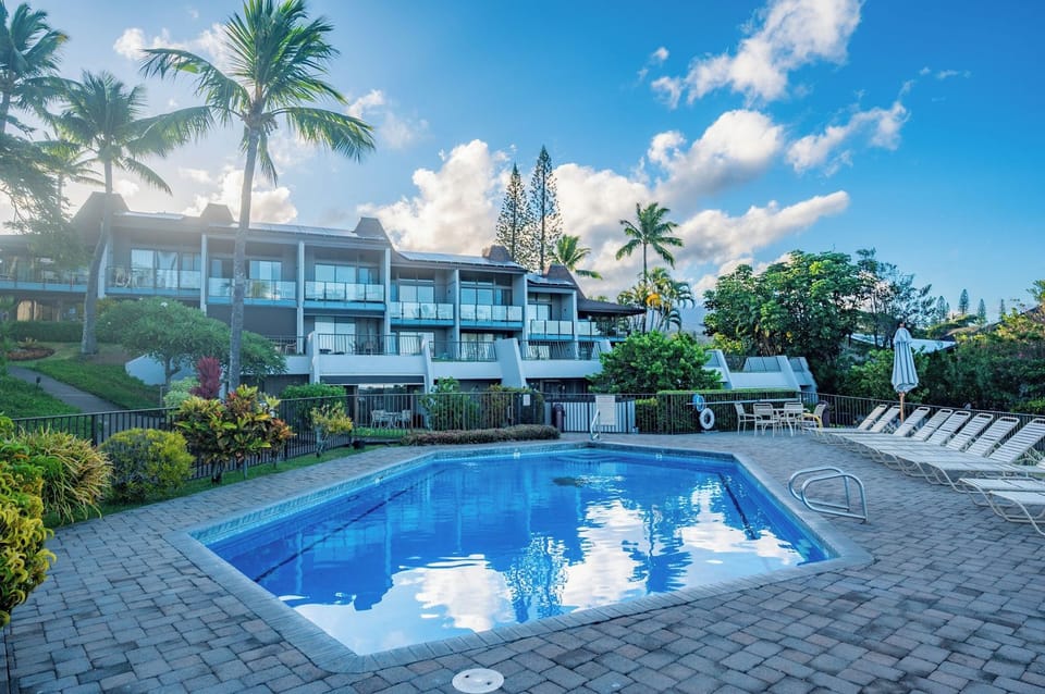 Tropical greenery surrounds this Napili Point pool, set just below private lanais for a quiet, easy-access swim anytime of day.