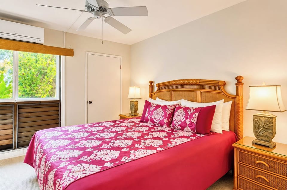 Fall asleep to the gentle sound of the ocean waves in the comfortable master bedroom, beautifully accented with tropical decor. NAP-B43