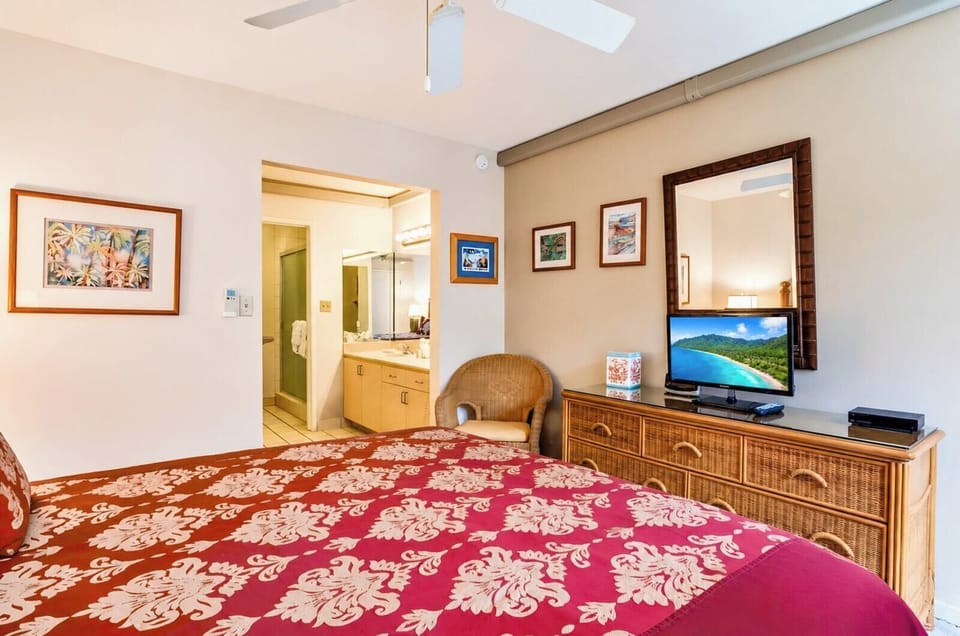 The primary suite features ample storage, a flat-screen TV, and easy access to your private en-suite bathroom. NAP-B43