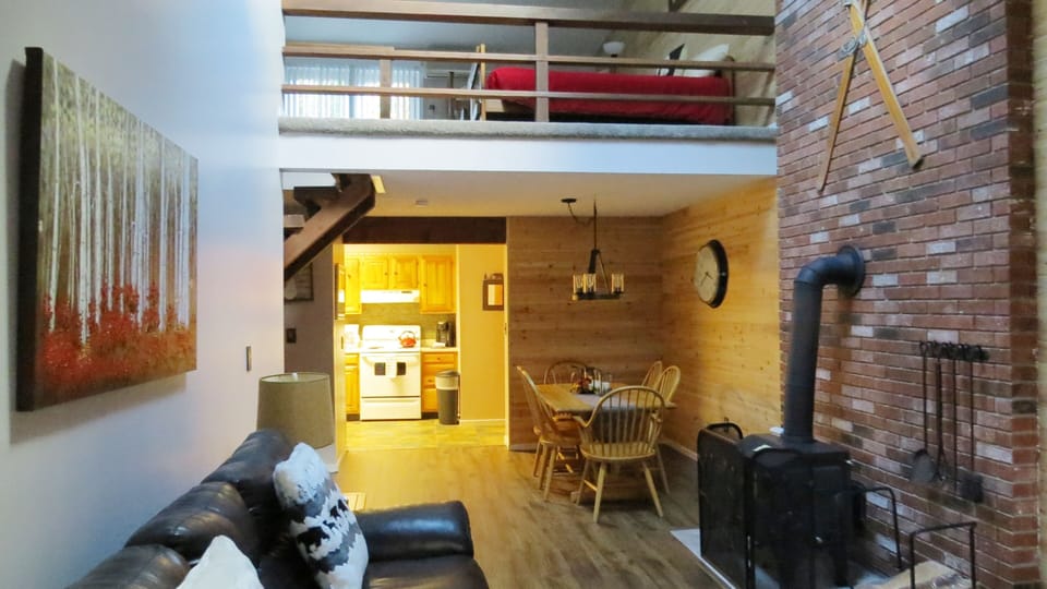 View to sleeping loft from living area
