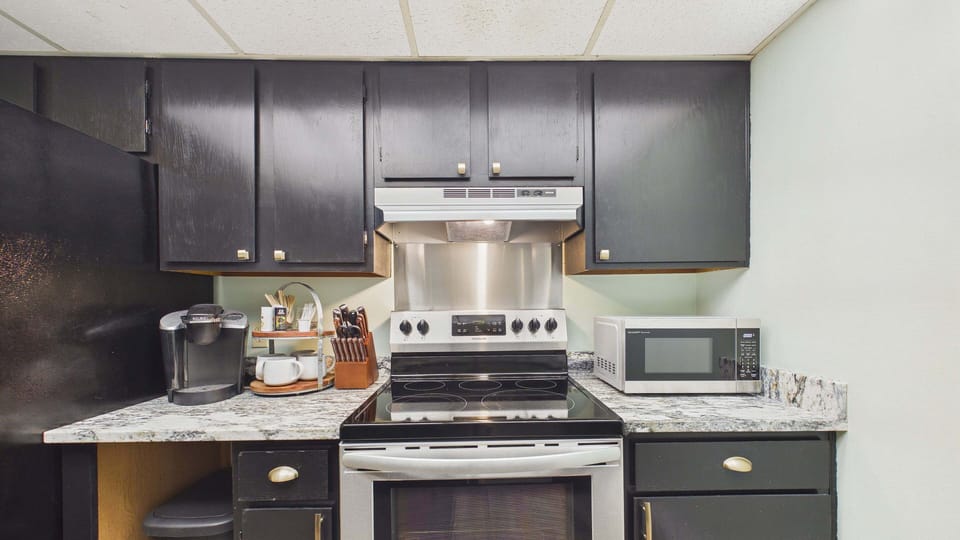 Fully applianced kitchen with all the cooking essentials and plenty of counter space for meal prep