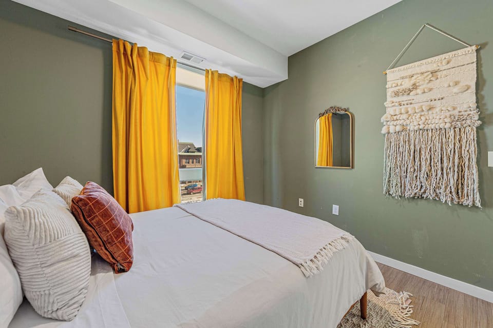 Rest comfortably in a peaceful bedroom designed for relaxation after a full day in Minneapolis.