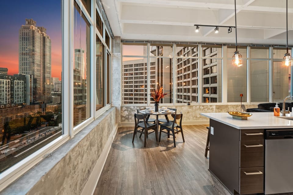 Enjoy front row sunset views while dining or relaxing in this open concept space. Floor to ceiling windows surround you with skyline scenery from morning light to evening glow.