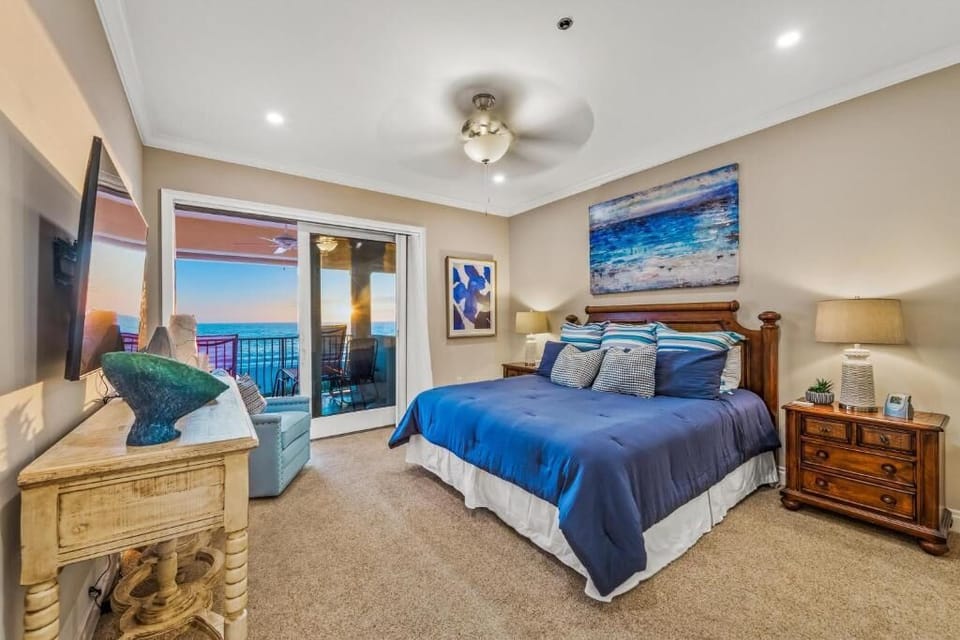 The Master bedroom has a king bed, balcony access, and oceanview and beach view!