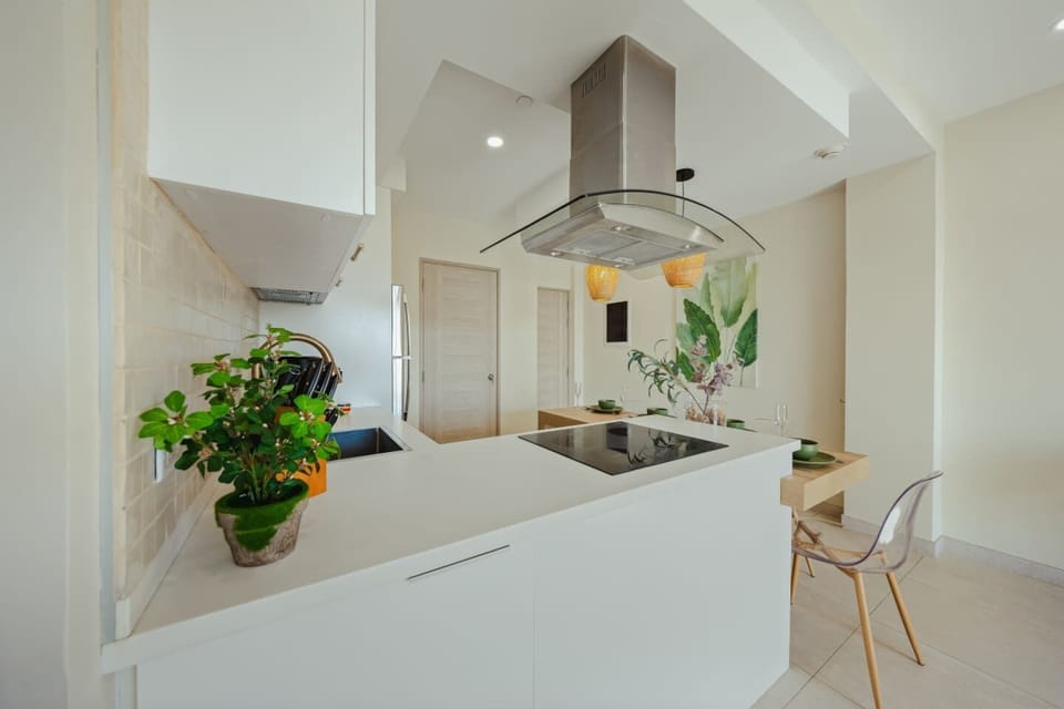 Bright, modern kitchen with an open layout, making it easy to cook, dine, and spend time together.