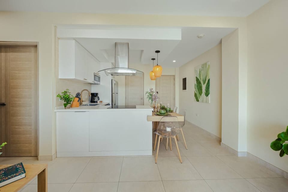 Open-concept kitchen and dining area with everything needed for easy meals, morning coffee, or a relaxed night in.