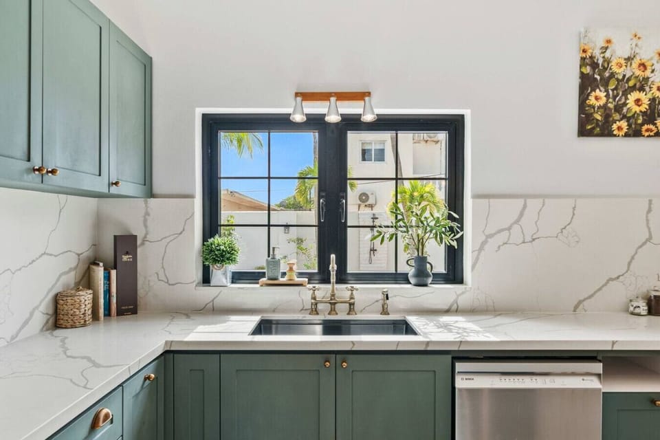 Bright kitchen with marble counters, ideal for morning coffee before beach outings