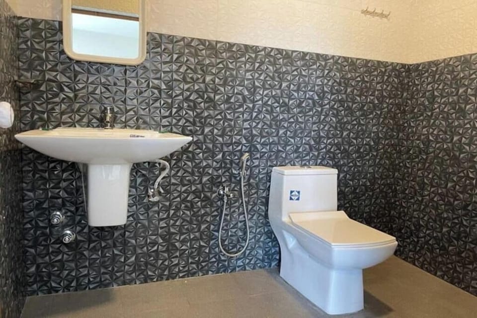Shower, rainfall showerhead, slippers, towels