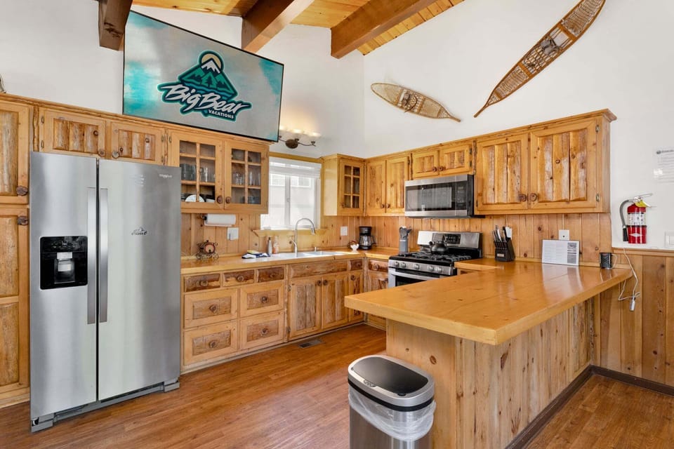 Fully equipped cabin kitchen with ample cabinetry, stove, fridge, microwave, and coffee maker—perfect for cooking meals, morning coffee, and feeling right at home on your stay.