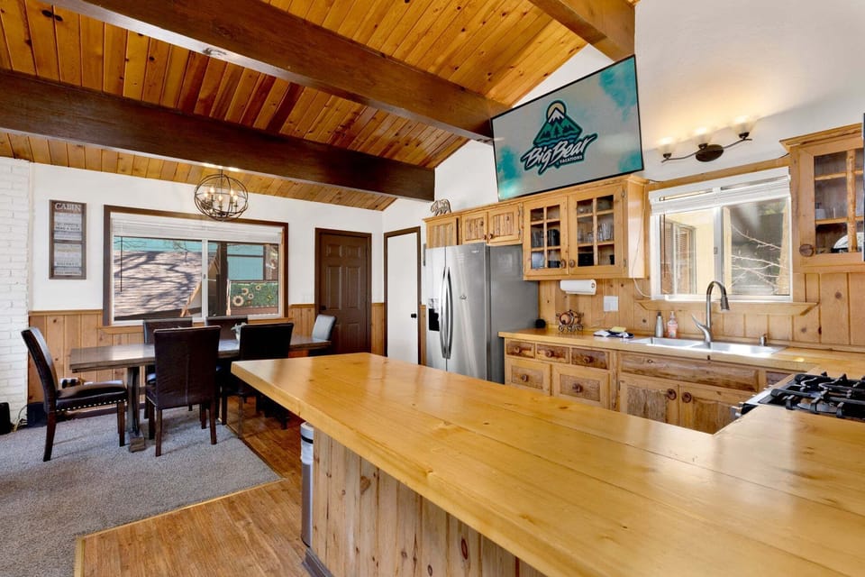 Fully equipped cabin kitchen with ample cabinetry, stove, fridge, microwave, and coffee maker—perfect for cooking meals, morning coffee, and feeling right at home on your stay.
