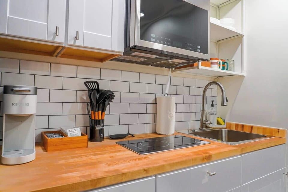 Fully equipped kitchen with new appliances, cookware, and everything needed to prepare meals.