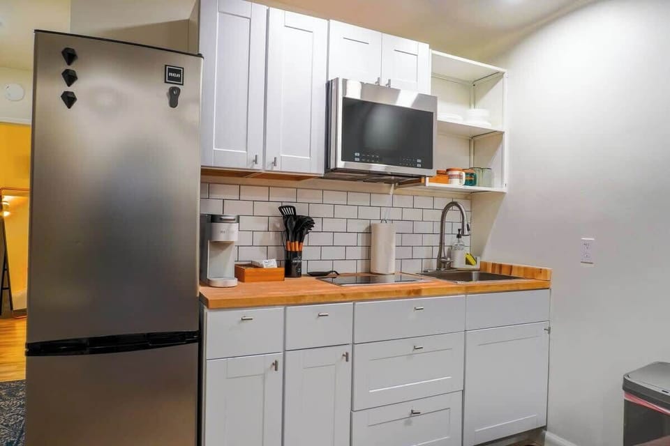 Fully equipped kitchen with new appliances, cookware, and everything needed to prepare meals.