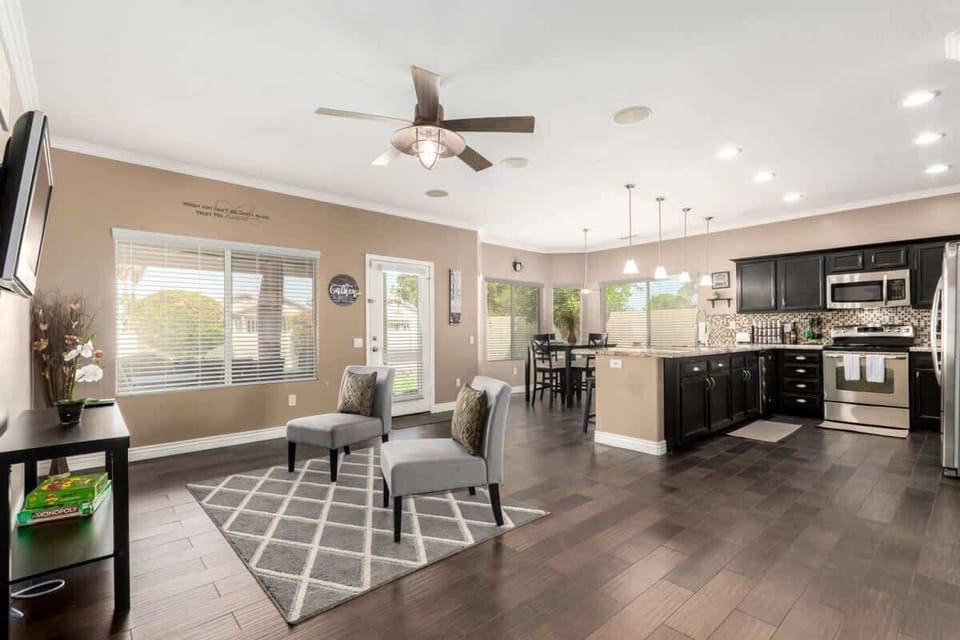 Spacious living room with cozy seating and smart TV—perfect for relaxing after a day out.