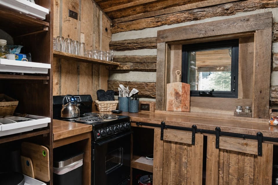 Rustic log cabin kitchen with warm wood details and cozy charm