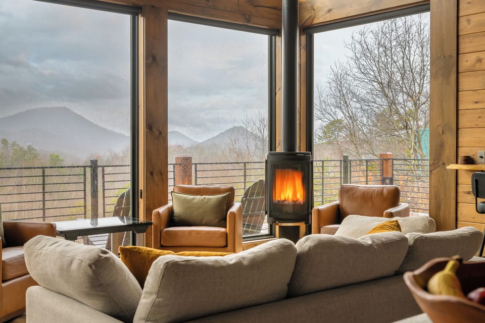 Relax by the fire with panoramic Smoky Mountain views from the living room
