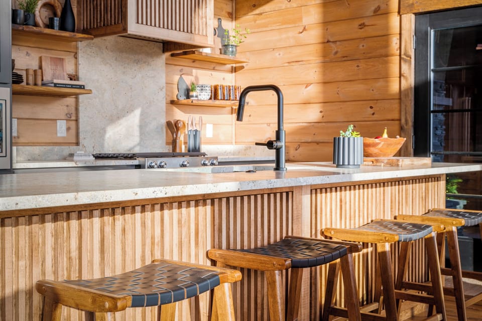 Modern kitchen with bar seating — perfect for coffee, cocktails, and conversation