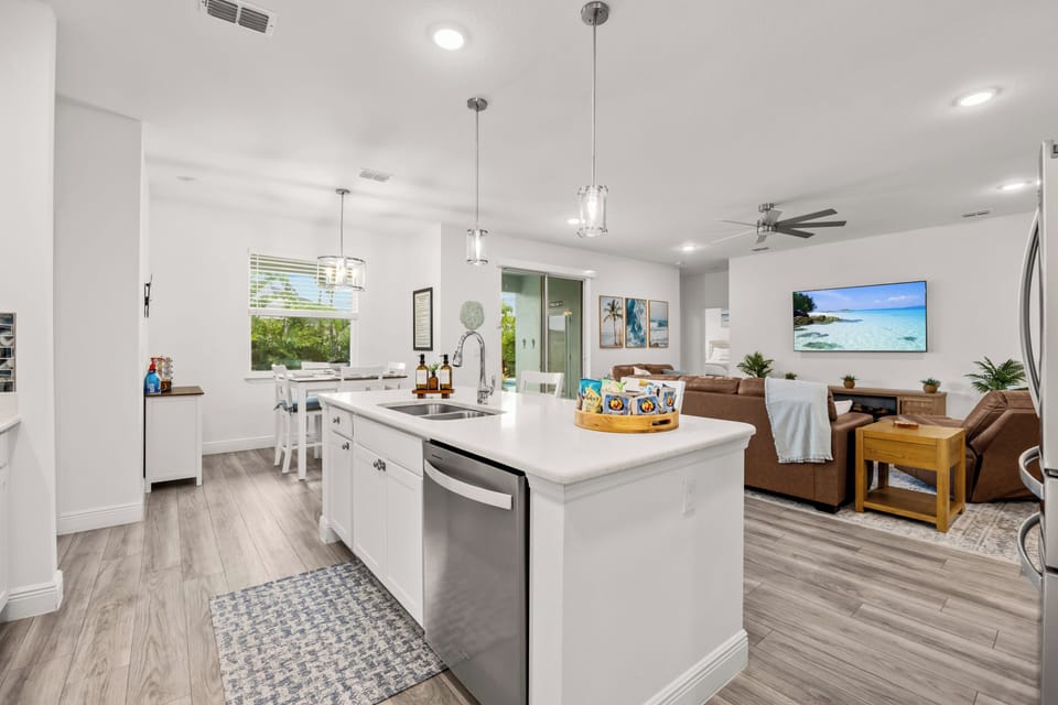 An open kitchen with an island that keeps the cook in the conversation.