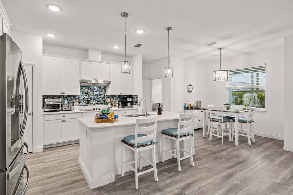 A bright, fully equipped kitchen made for real meals, easy mornings, and everyone gathering around the island.