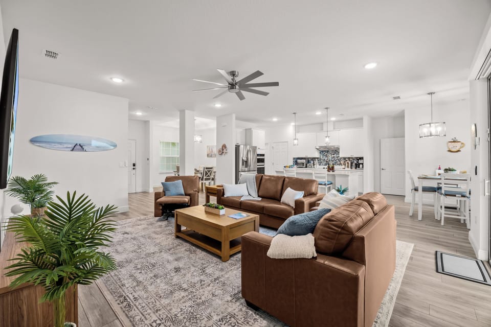 The living room, kitchen, and dining areas flow together so the group can stay connected without feeling crowded.