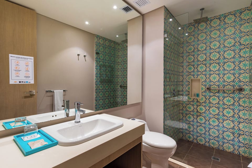 Rainfall showerhead, eco-friendly toiletries, hair dryer, towels