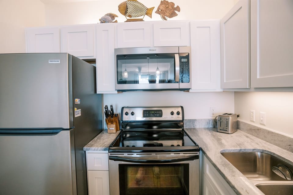 All the kitchen amenities you'd need - includes baking sheets, muffin tin, pots, pans, skillets, cooking utensils, blender, etc. Just ask if you are looking for something specific!