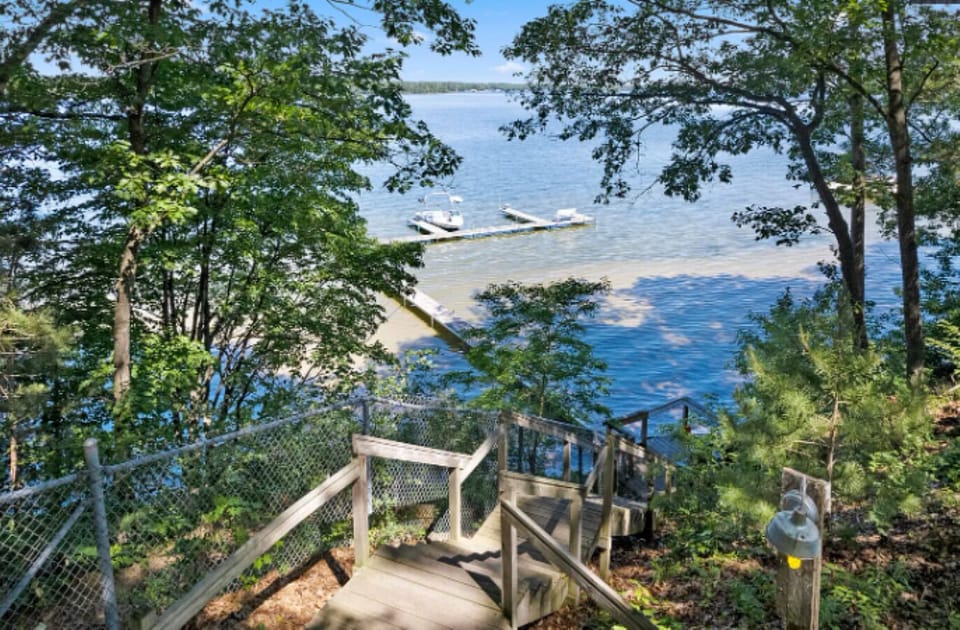 About 20 wood steps with a railing down to the water
